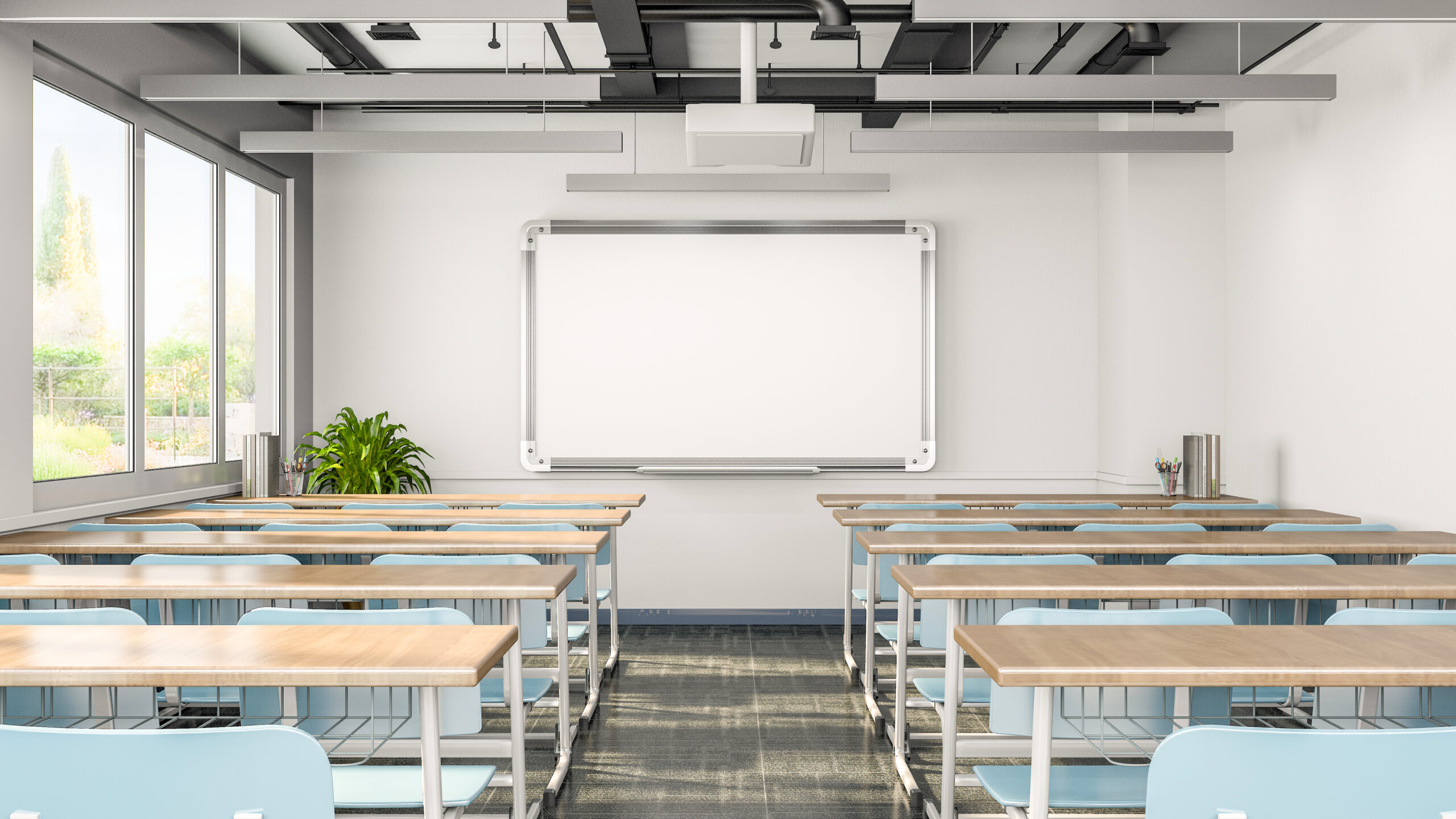 Life moves fast in learning environments, offices, and educational spaces that leverage today’s whiteboard in classroom solutions, like this image of a modern youth or adult classroom with a whiteboard at the front.